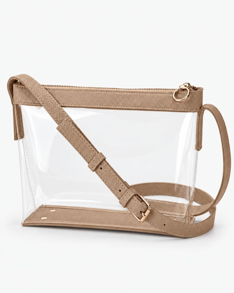 Beige clear crossbody purse with vegan leather trim, gold-tone zipper and buckle, empty, in a three-quarter view on white