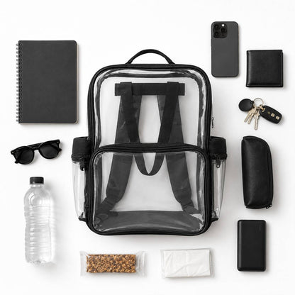 Top-down flatlay of the clear backpack with cloth bottom surrounded by a notebook, sunglasses, water bottle, phone, wallet, keys, and a pencil case.