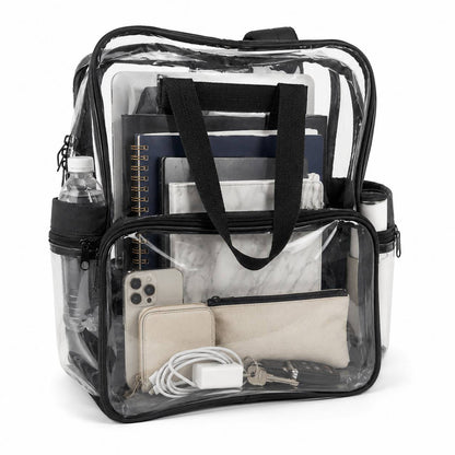 Clear backpack with cloth bottom filled with a marble notebook, zip pouch, charging cable, and wallet visible through the clear panels.