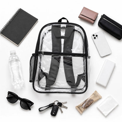Clear backpack surrounded by sunglasses, keys, water bottle, snacks, and travel essentials
