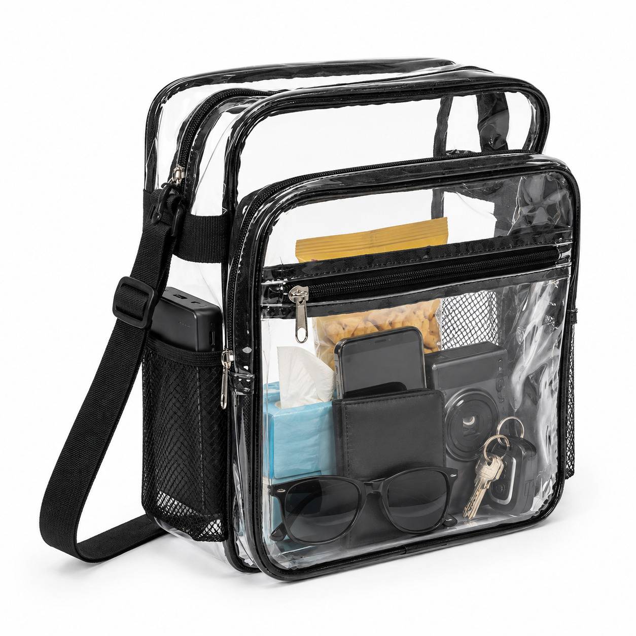 Items packed inside a clear crossbody bag: snacks, phone, wallet, camera, sunglasses, keys