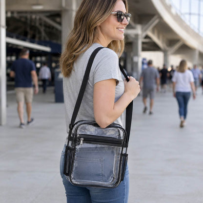 Woman wearing a clear crossbody bag with mesh side pockets at a stadium entrance