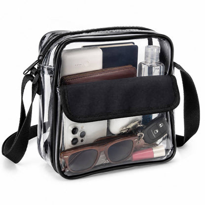 Clear cross-body messenger bag in black with phone, wallet, sunglasses, and keys visible inside