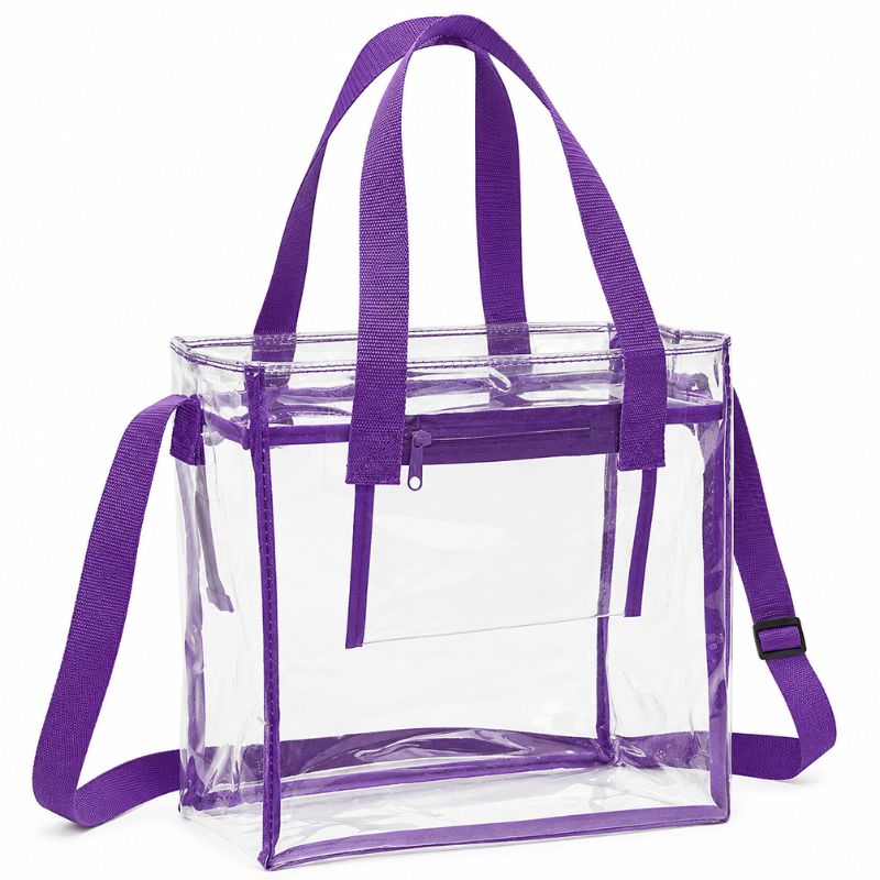 Clear crossbody tote with purple trim, dual handles, top zipper and adjustable shoulder strap.