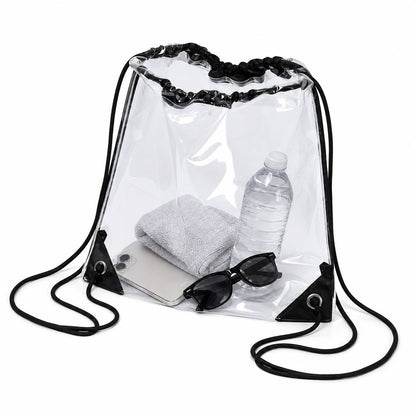 Clear drawstring backpack bag packed with a towel, water bottle, phone, and sunglasses, shown at an angle.
