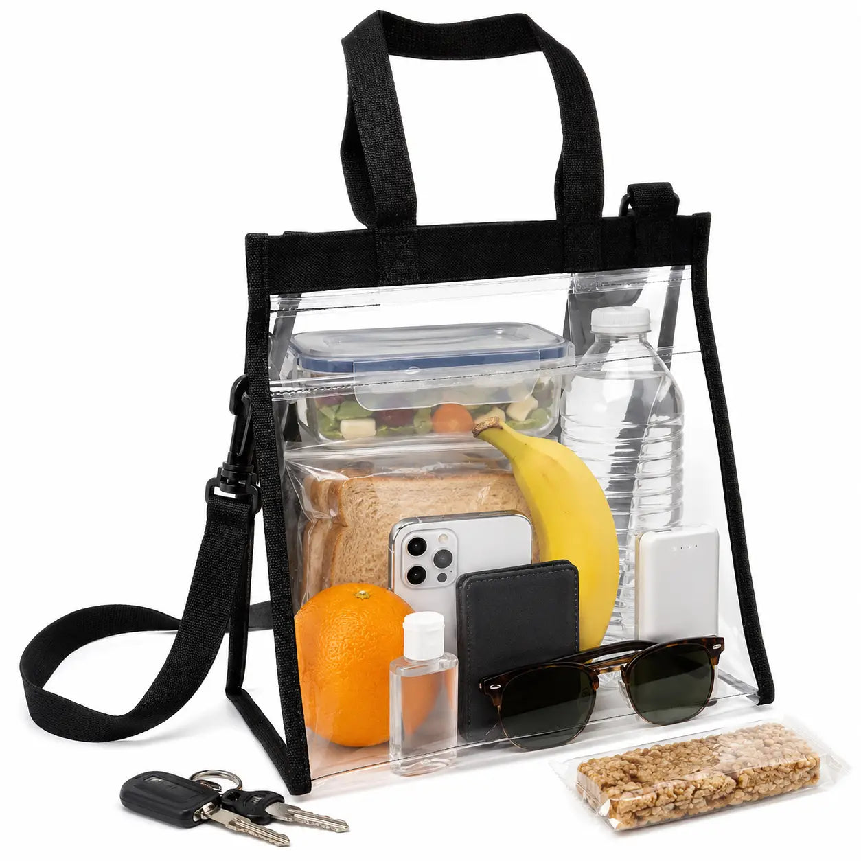 Clear lunch bag tote with black trim and crossbody strap filled with a sandwich, fruit and water bottle