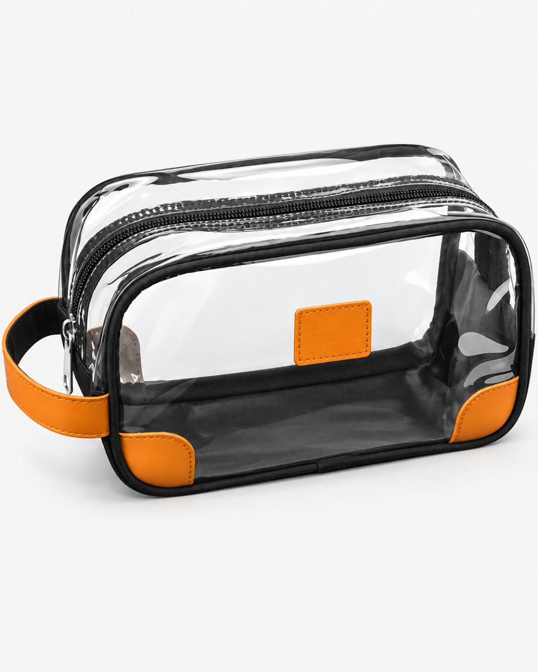 Clear travel toiletry bag with orange trim, black fabric base, top zipper and side carry strap, shown empty on a white background.
